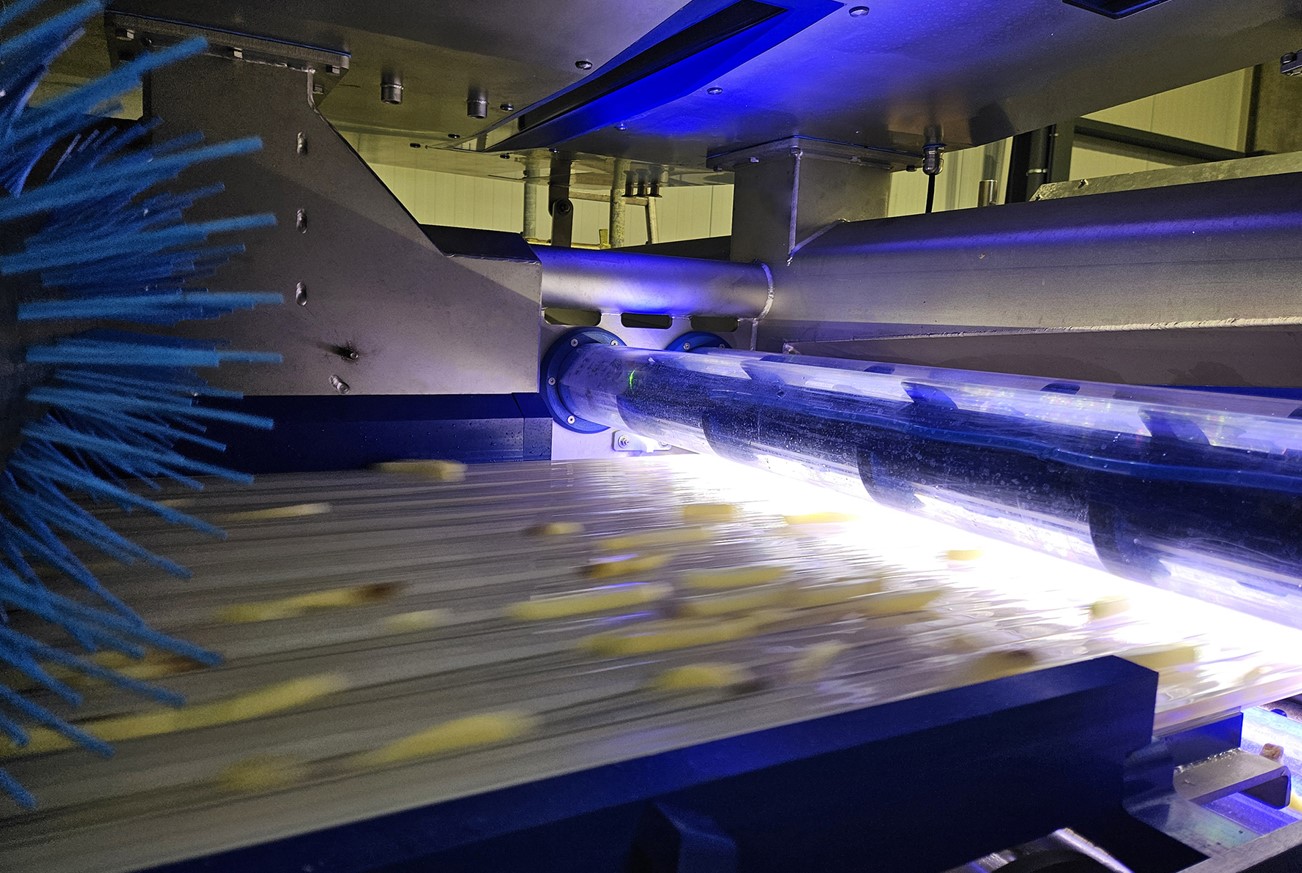 fast-motion photo showing potato strips being passed along