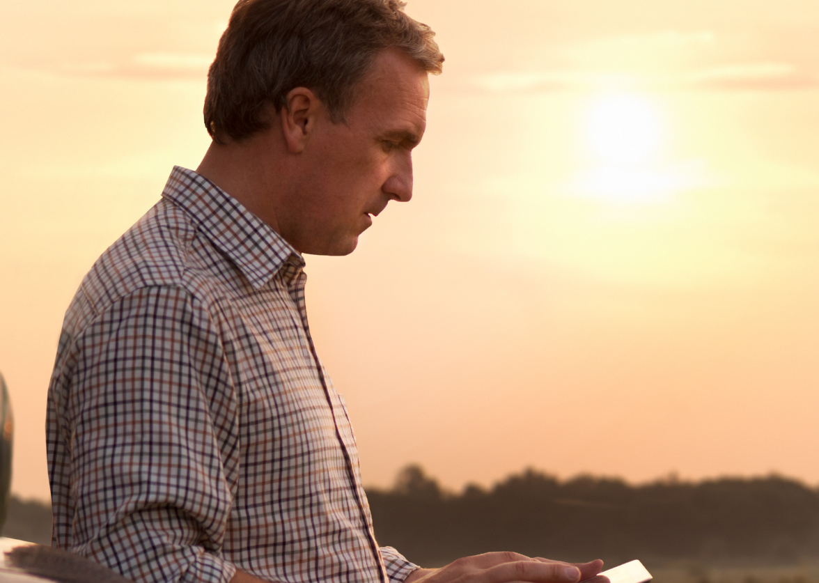 Farmer looking at screen on ipad