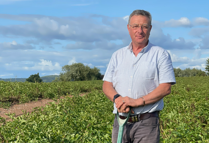 Agronomist Andrew Goodinson standing in potato field