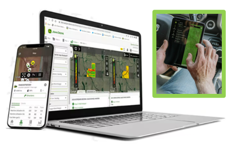 Laptop showing agricultural management and hand holding small screen in tractor showing field map