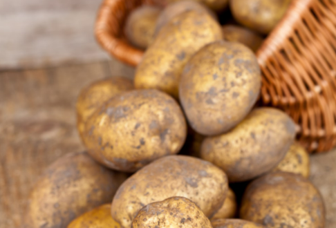 potatoes spilling out of wicker basket