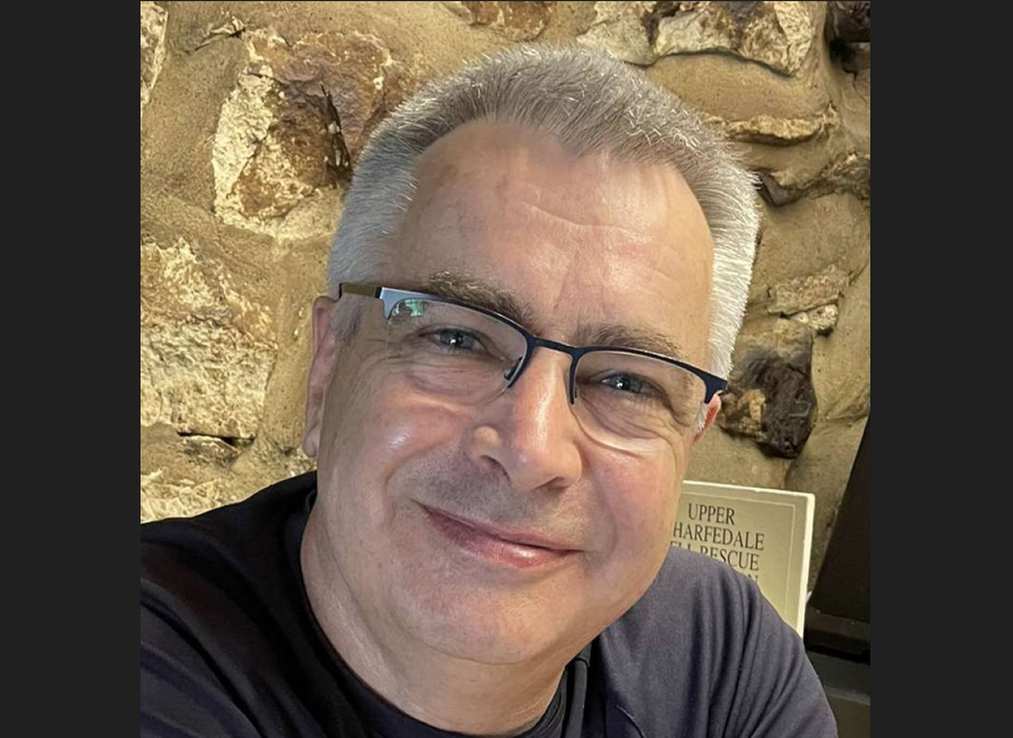 Close up of man wearing glasses giving advice on soil sampling