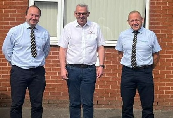 Duncan Pound, James Bond and Richard Parish in front of the new Standen dealership