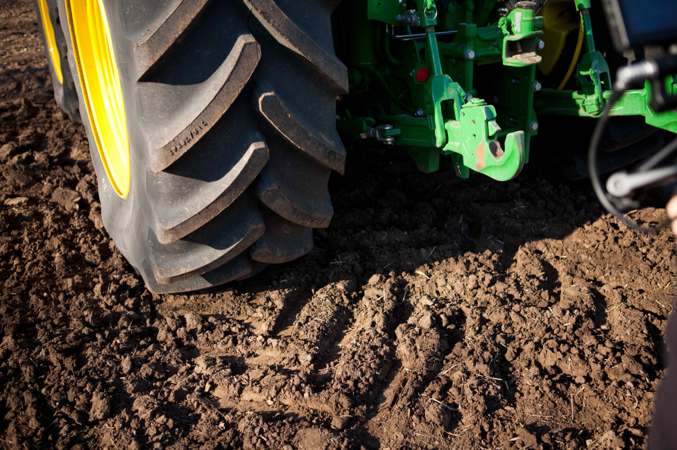 Agricultural tyre on soil, showing compaction