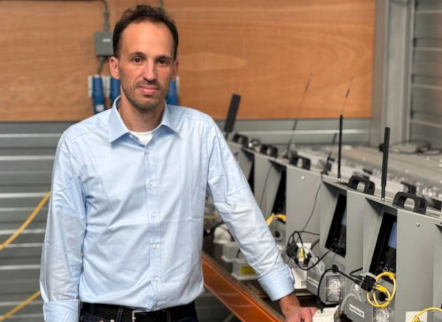 Yotam Guetta leaning on machinery at potato storage solutions premises