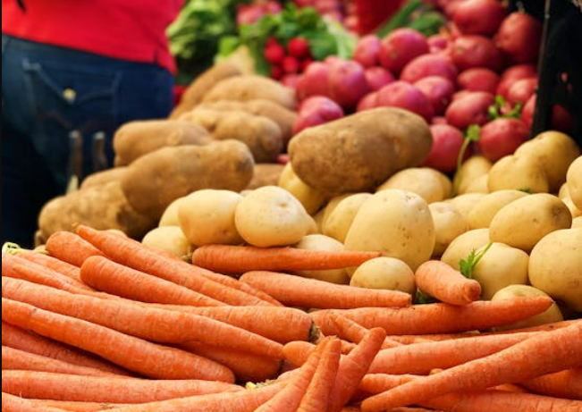 fruit and vegetables displayed on market, mainly potato