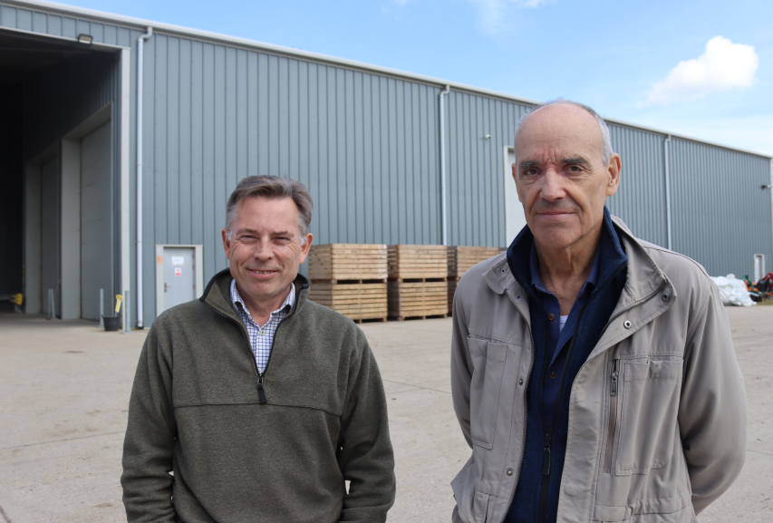 Farmer and supplier shown outside new potato store