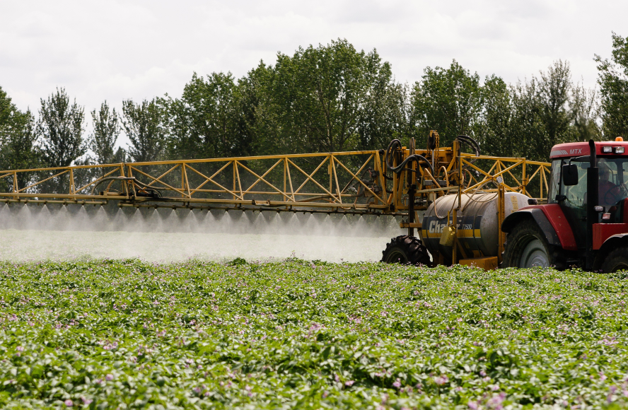 sprayer in potato field